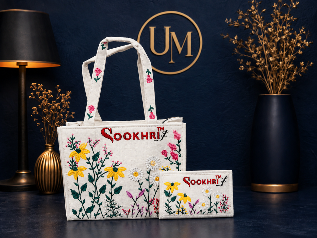 traditional embroidered jute tote bag and matching wallet set from the brand Sookhri featuring floral embroidery The tote bag